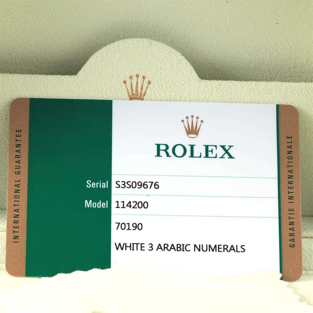 This image shows the international guarantee card for a Rolex Oyster Perpetual 114200 Men
s Stainless Steel White Dial 114200 Men
s Stainless Steel White Dial model 114200 with white 3 Arabic numerals.