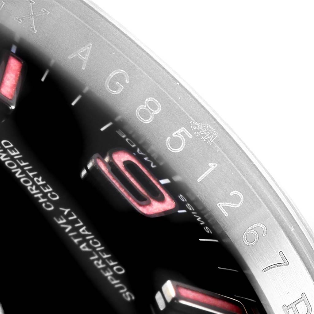 The image shows a close-up of the outer rim and part of the dial of a Rolex Oyster Perpetual 116000 Men's Stainless Steel Black Dial 116000 Men's Stainless Steel Black Dial model watch.