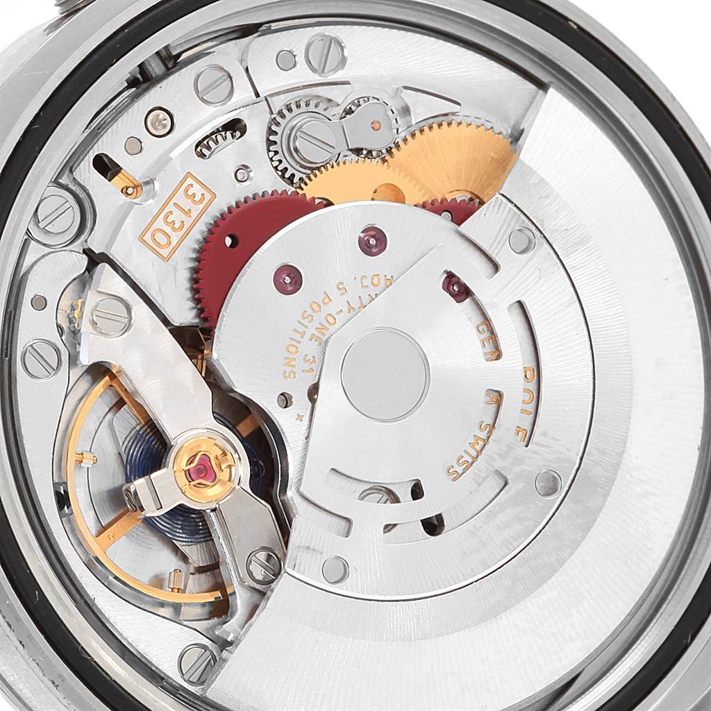 This image shows the intricate internal mechanism of a Rolex Oyster Perpetual 116000 Men's Stainless Steel Black Dial 116000 Men's Stainless Steel Black Dial watch from a close-up angle.