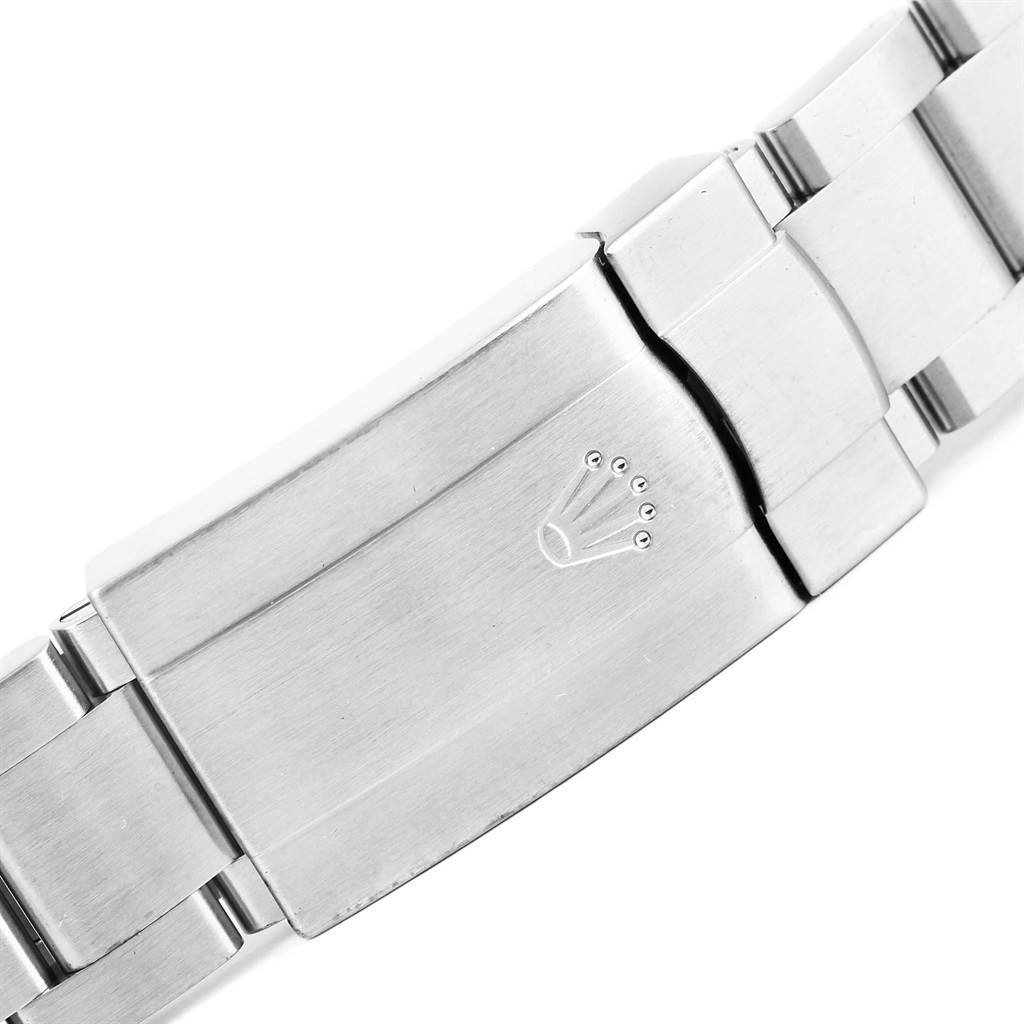 This is a close-up of the clasp on the bracelet of a Rolex Oyster Perpetual 116000 Men's Stainless Steel Black Dial 116000 Men's Stainless Steel Black Dial watch.