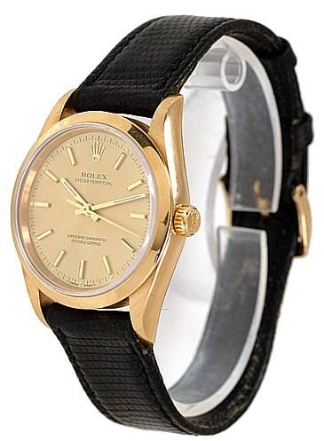 This is a frontal angle view of the Rolex Oyster Perpetual 14208 Men
s Yellow Gold Champagne Dial 14208 Men
s Yellow Gold Champagne Dial watch, showing the face, bezel, and strap.