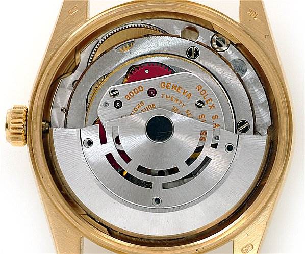 This image shows the internal mechanism of a Rolex Oyster Perpetual 14208 Men
s Yellow Gold Champagne Dial 14208 Men
s Yellow Gold Champagne Dial watch, viewed from the back.