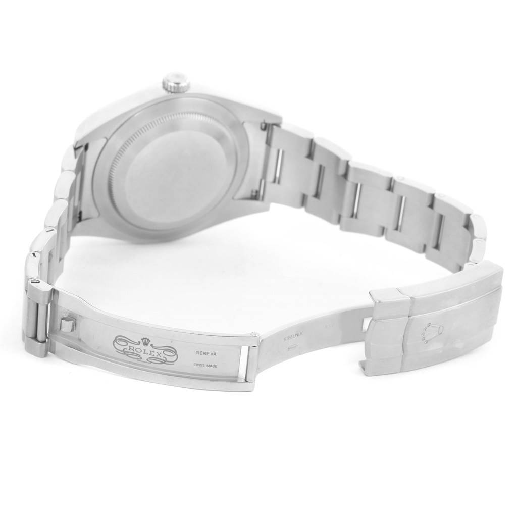 The image shows the open clasp and backside of the Oyster Perpetual model by Rolex.