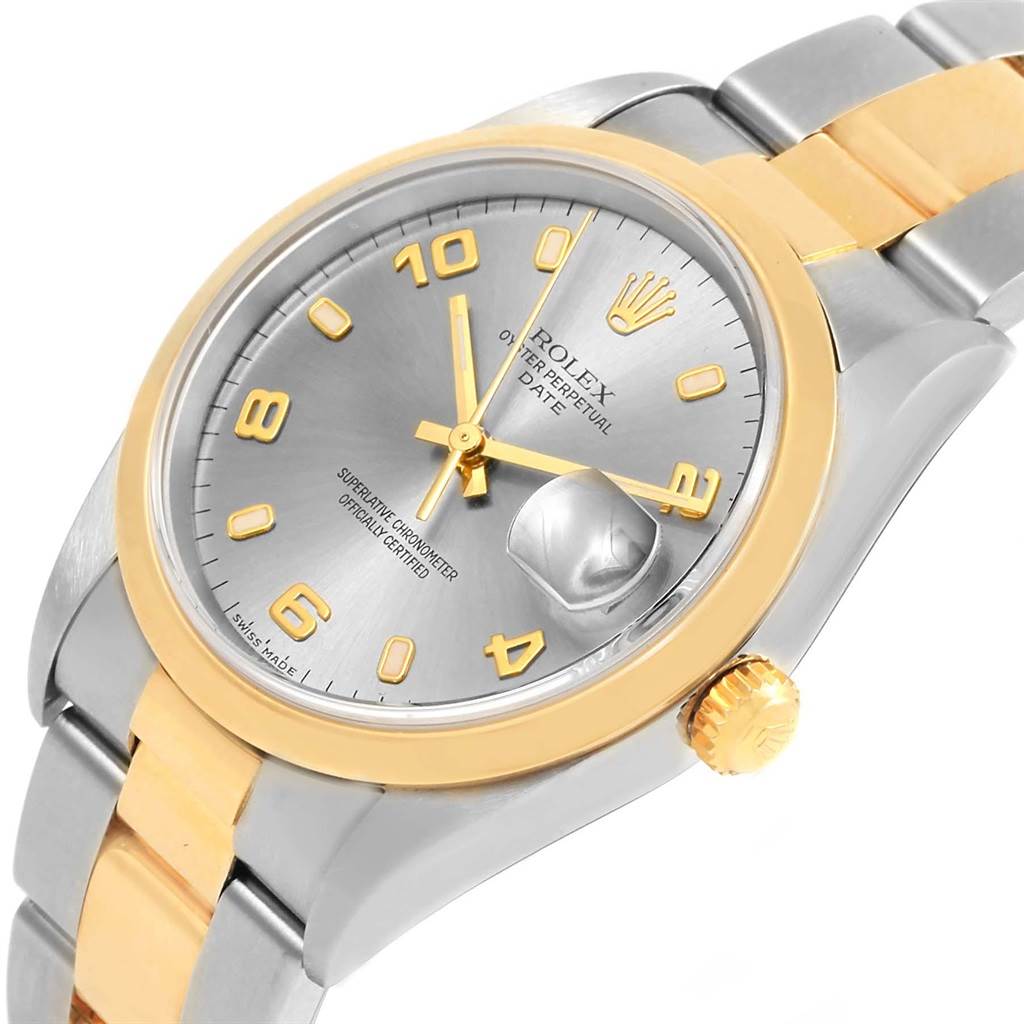 This image shows a Rolex Oyster Perpetual 15203 Men's Steel and Gold (two tone) Grey Dial 15203 Men's Steel and Gold (two tone) Grey Dial watch from an oblique angle, highlighting the dial, bezel, crown, and part of the bracelet.
