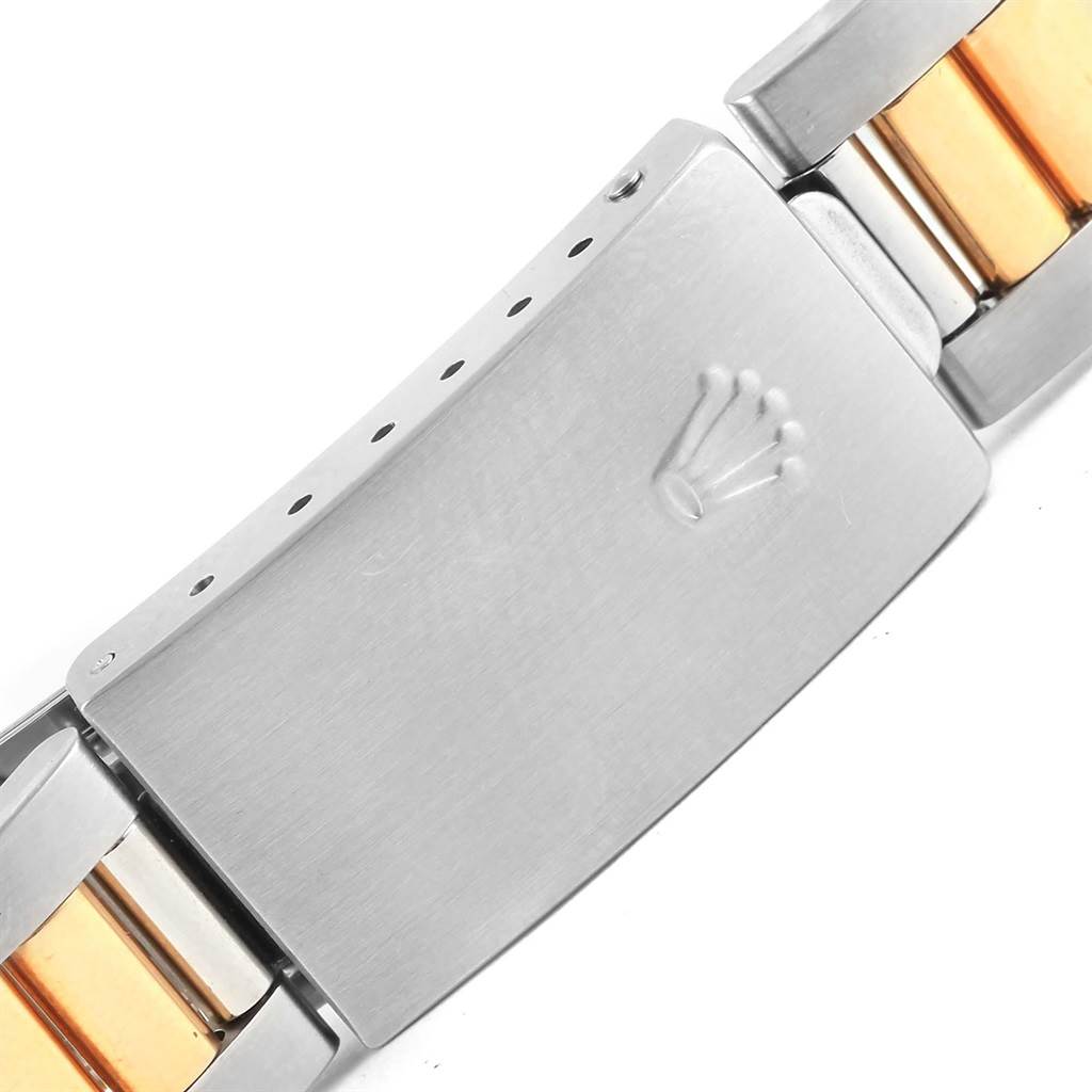 This image shows a close-up of the clasp and part of the bracelet of a Rolex Oyster Perpetual 15203 Men's Steel and Gold (two tone) Grey Dial 15203 Men's Steel and Gold (two tone) Grey Dial watch.