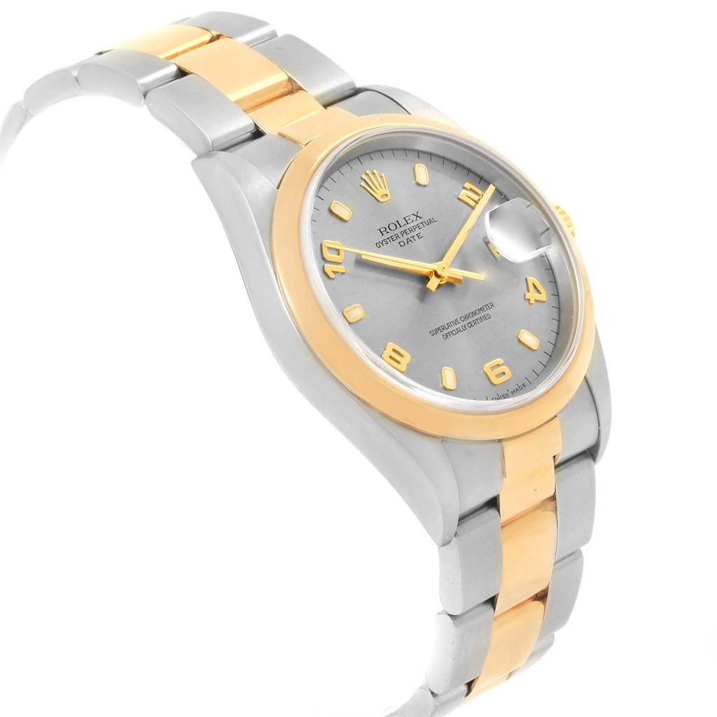 This image shows a Rolex Oyster Perpetual 15203 Men's Steel and Gold (two tone) Grey Dial 15203 Men's Steel and Gold (two tone) Grey Dial watch at an angled view, highlighting its two-tone band, bezel, and dial.