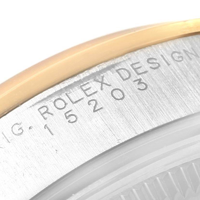 This image shows a close-up of the side of the Rolex Oyster Perpetual 15203 Men's Steel and Gold (two tone) Grey Dial 15203 Men's Steel and Gold (two tone) Grey Dial watch, displaying the engraved model number "15203."