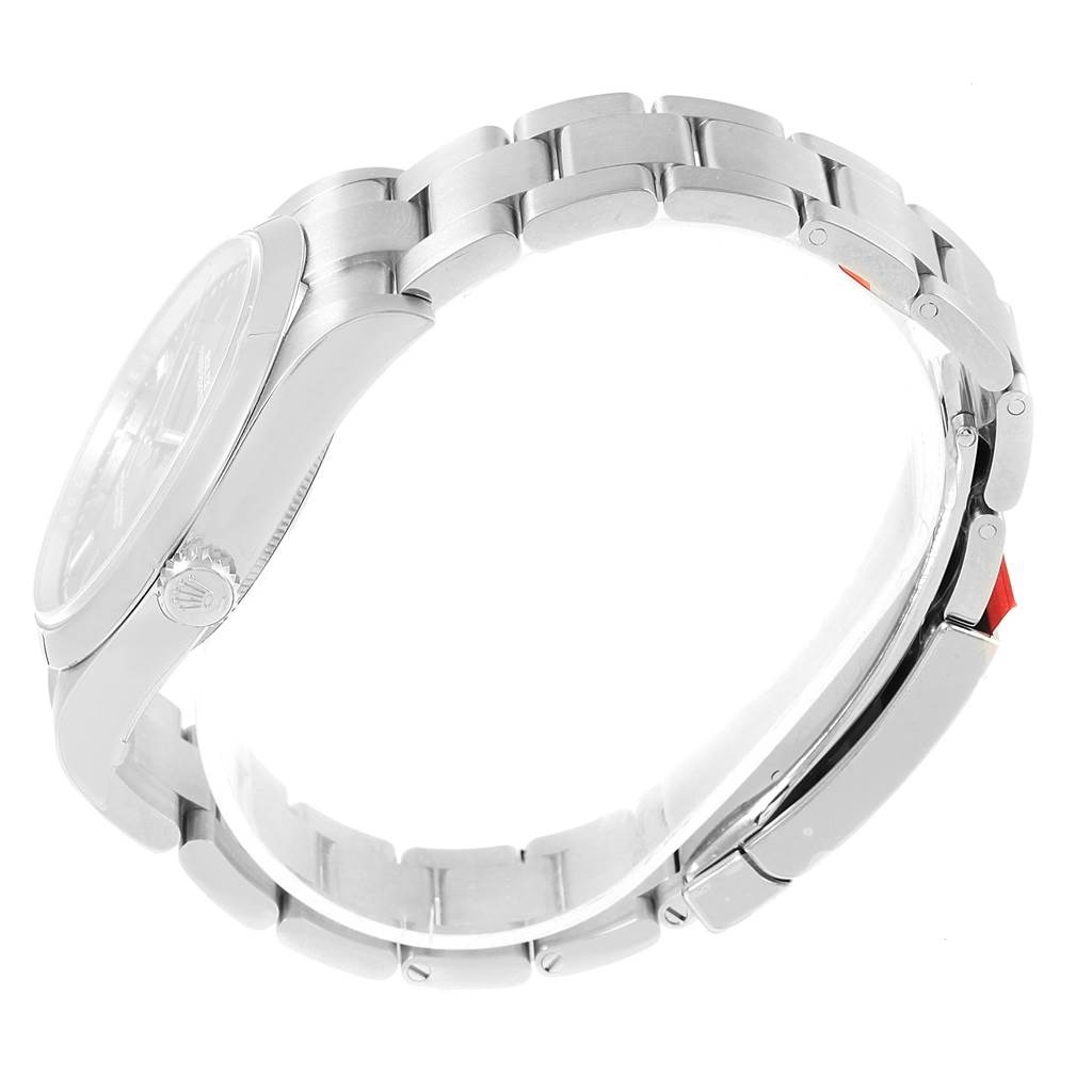 The image shows a side view of a Rolex Oyster Perpetual 114300 Stainless Steel Burgundy Dial 114300 Stainless Steel Burgundy Dial watch, highlighting its bracelet and side profile.