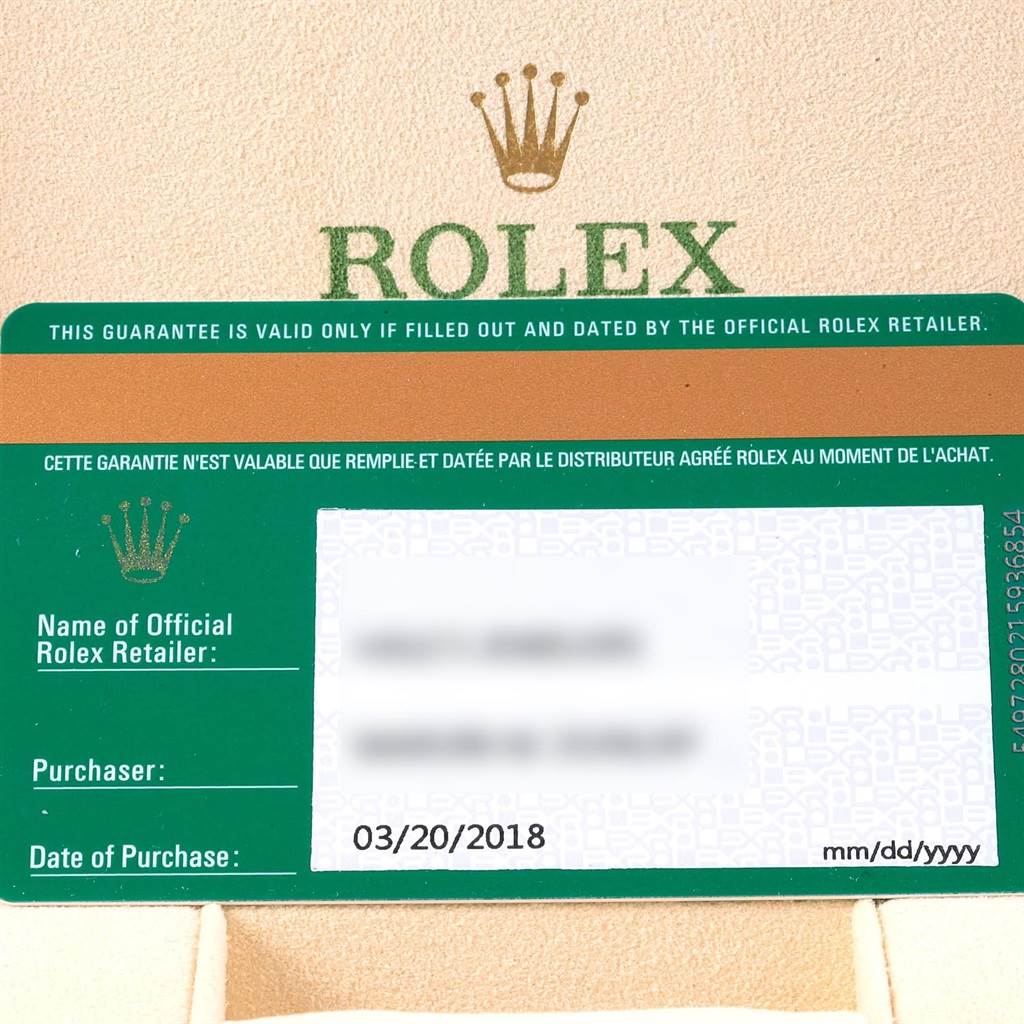 The image shows a guarantee card for a Rolex Oyster Perpetual 114200 Stainless Steel Champagne Dial 114200 Stainless Steel Champagne Dial watch, along with the Rolex branding and purchase details.