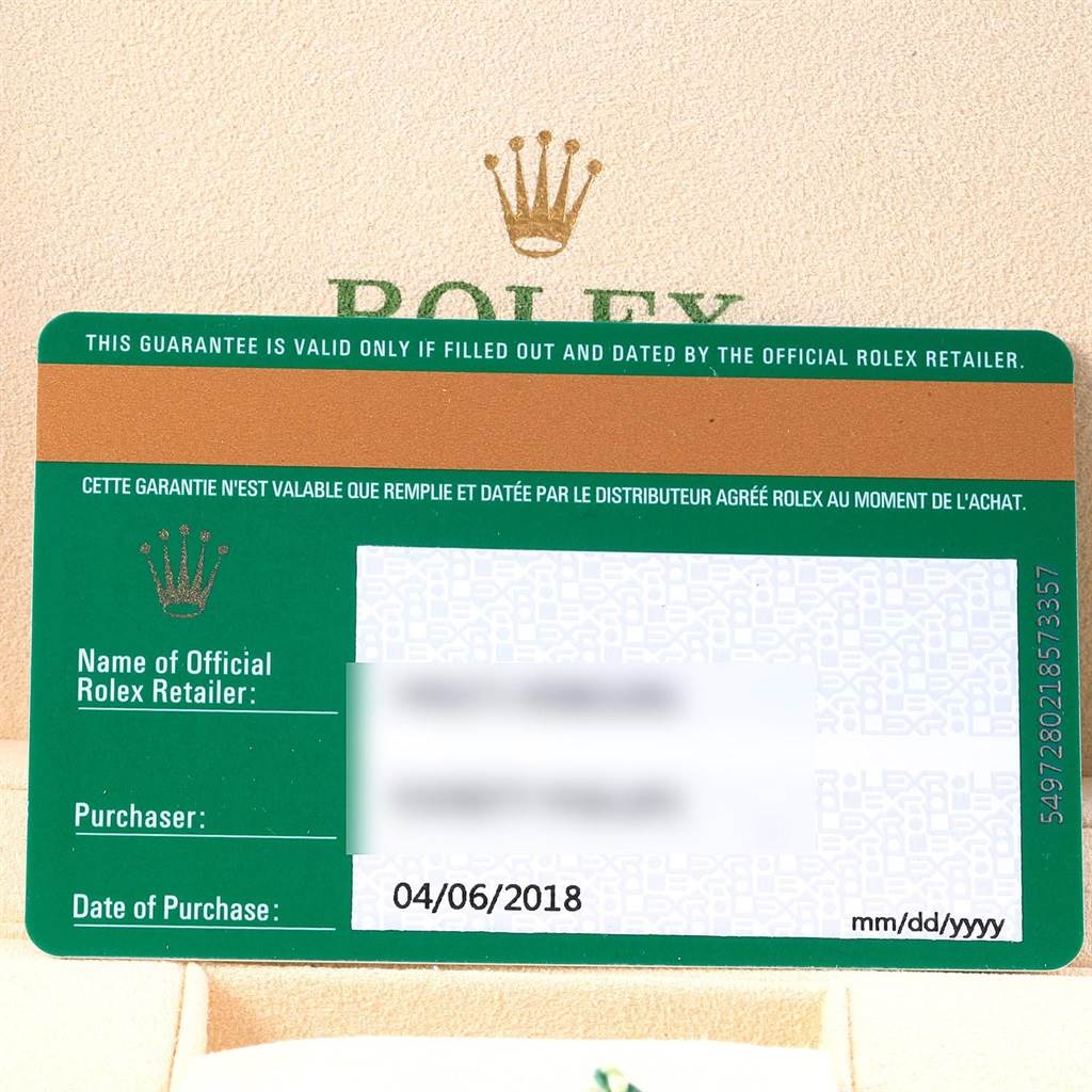 This image displays a guarantee card for a Rolex Oyster Perpetual 114200 Men's Stainless Steel Blue Dial 114200 Men's Stainless Steel Blue Dial watch, showing purchase details and retailer information.