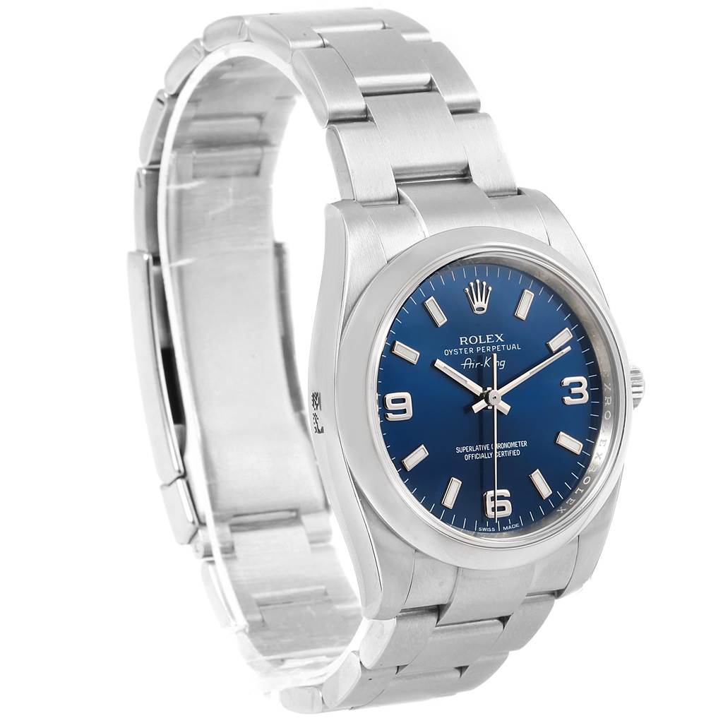 The image shows a side angle of the Rolex Oyster Perpetual 114200 Men's Stainless Steel Blue Dial 114200 Men's Stainless Steel Blue Dial model, displaying the watch face, bracelet, and clasp.
