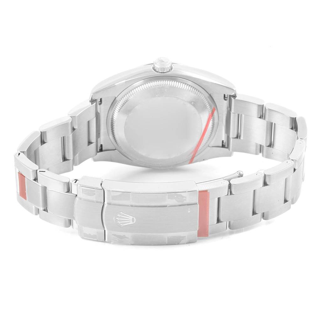 This image shows the back of a Rolex Oyster Perpetual 114200 Men's Stainless Steel Champagne Dial 114200 Men's Stainless Steel Champagne Dial watch, highlighting the case back and bracelet with a visible clasp.