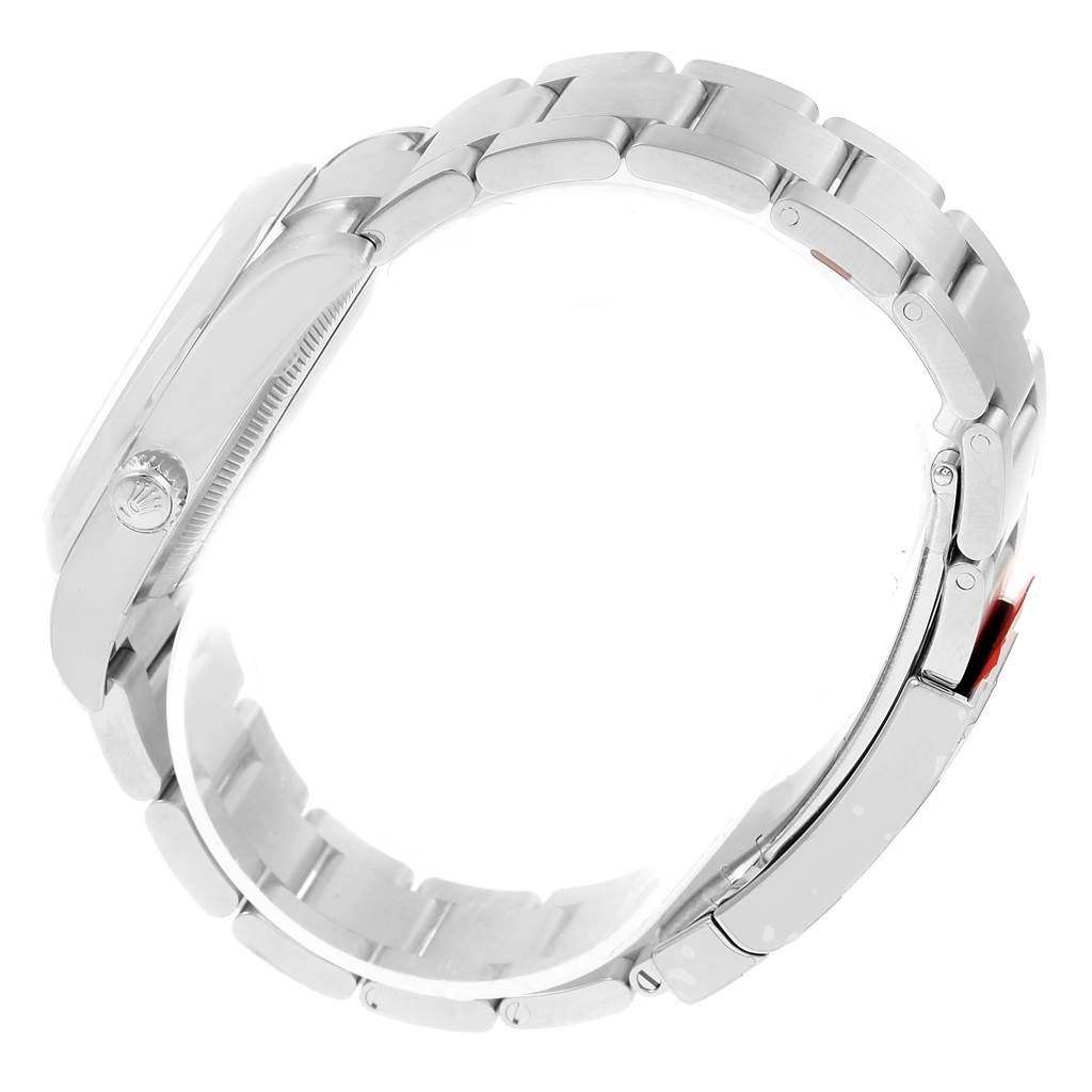 This image shows a side view of the bracelet and part of the case of a Rolex Oyster Perpetual 114200 Men's Stainless Steel Champagne Dial 114200 Men's Stainless Steel Champagne Dial watch.