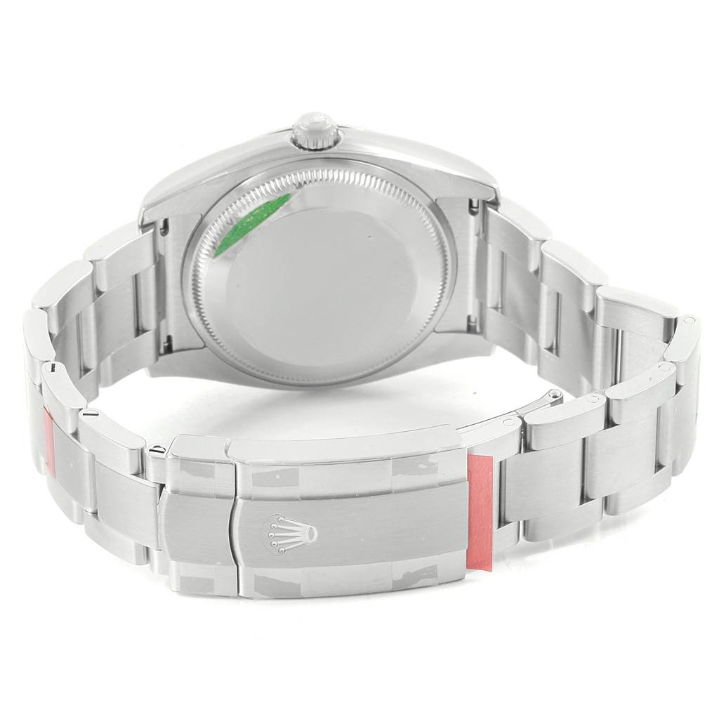 The image shows the back side of a Rolex Oyster Perpetual 114200 Men's Stainless Steel Blue Dial 114200 Men's Stainless Steel Blue Dial watch, highlighting the clasp, bracelet, and case back.