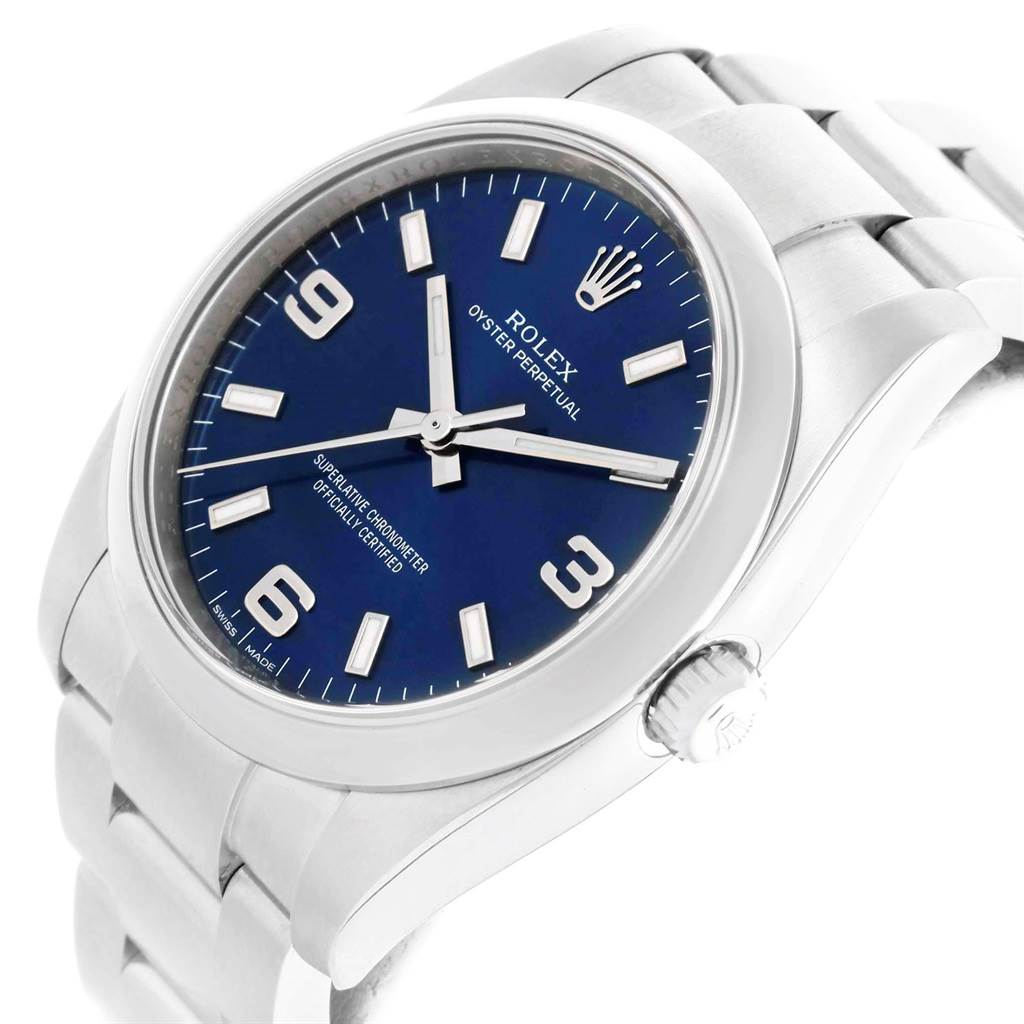 This image displays a side angled view of the Rolex Oyster Perpetual 114200 Men's Stainless Steel Blue Dial 114200 Men's Stainless Steel Blue Dial, showing its blue dial, stainless steel case, and bracelet.
