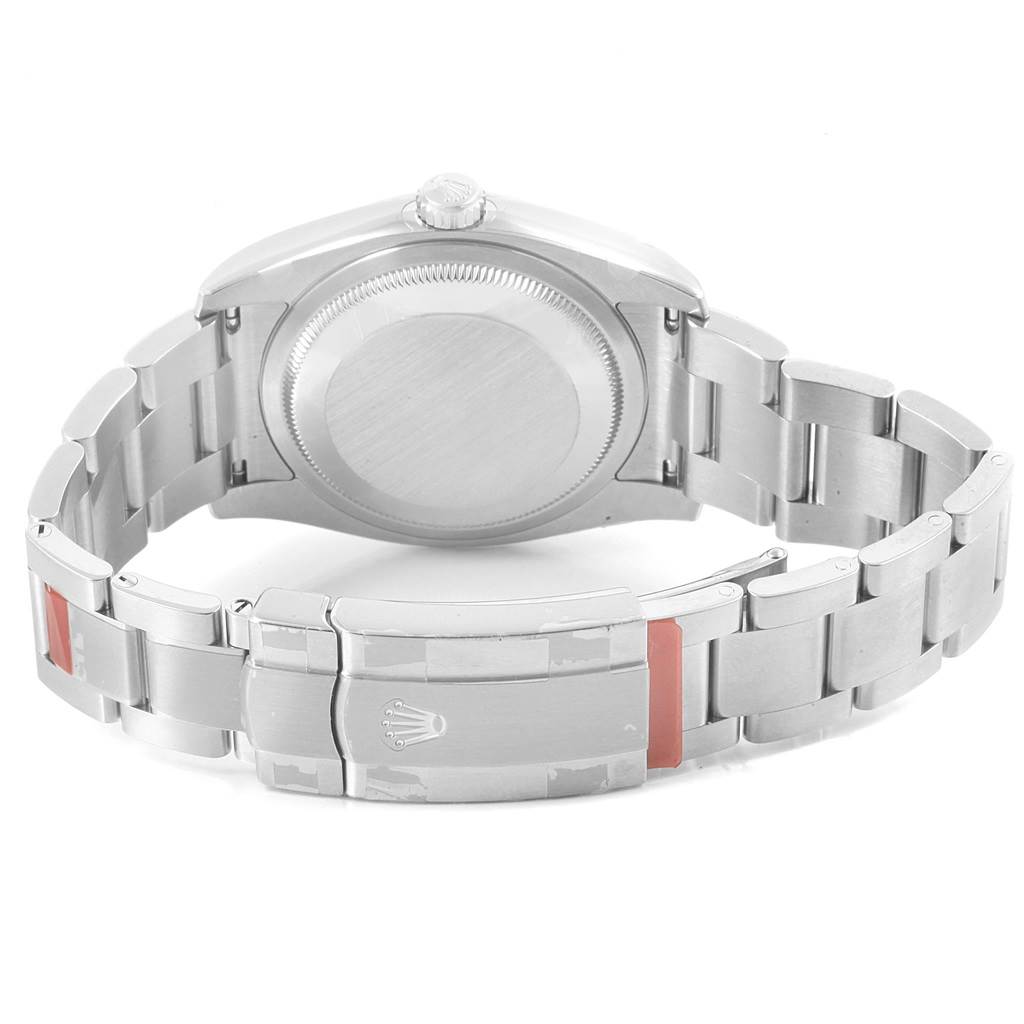 The image shows the back view of the Rolex Oyster Perpetual 116000 Men's Stainless Steel Champagne Dial 116000 Men's Stainless Steel Champagne Dial watch, highlighting the case back and bracelet clasp.