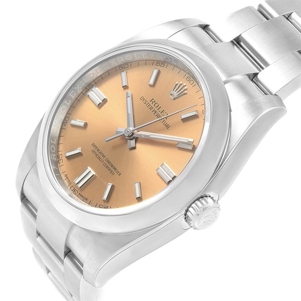 The image shows a Rolex Oyster Perpetual 116000 Men's Stainless Steel Champagne Dial 116000 Men's Stainless Steel Champagne Dial watch from a slightly tilted angle, revealing the face, crown, and part of the bracelet.
