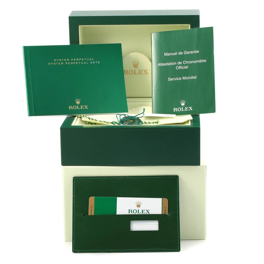 The image shows a Rolex Oyster Perpetual 116000 Men's Stainless Steel Champagne Dial 116000 Men's Stainless Steel Champagne Dial watch box with manuals, a service booklet, a warranty card, and a tag.