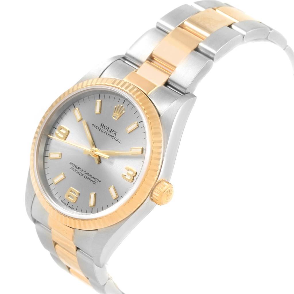 The image shows a Rolex Oyster Perpetual 14233 Men's Steel and Gold (two tone) Grey Dial 14233 Men's Steel and Gold (two tone) Grey Dial watch at a slight angle, highlighting its face, bezel, and bracelet.