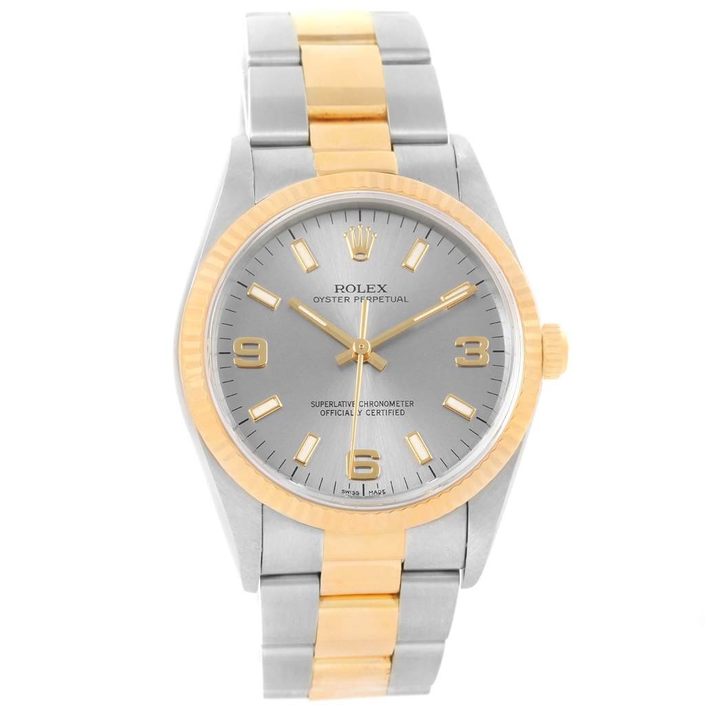 This image shows a frontal view of the Rolex Oyster Perpetual 14233 Men's Steel and Gold (two tone) Grey Dial 14233 Men's Steel and Gold (two tone) Grey Dial watch, highlighting its dial, bezel, and bracelet.