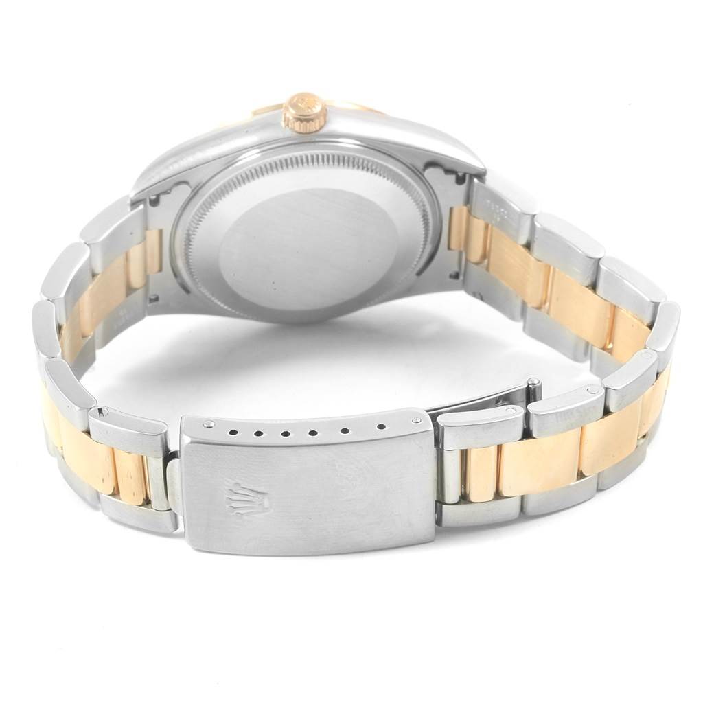 This Rolex Oyster Perpetual 14233 Men's Steel and Gold (two tone) Grey Dial 14233 Men's Steel and Gold (two tone) Grey Dial watch is shown from the back, displaying its case, bracelet, and clasp.