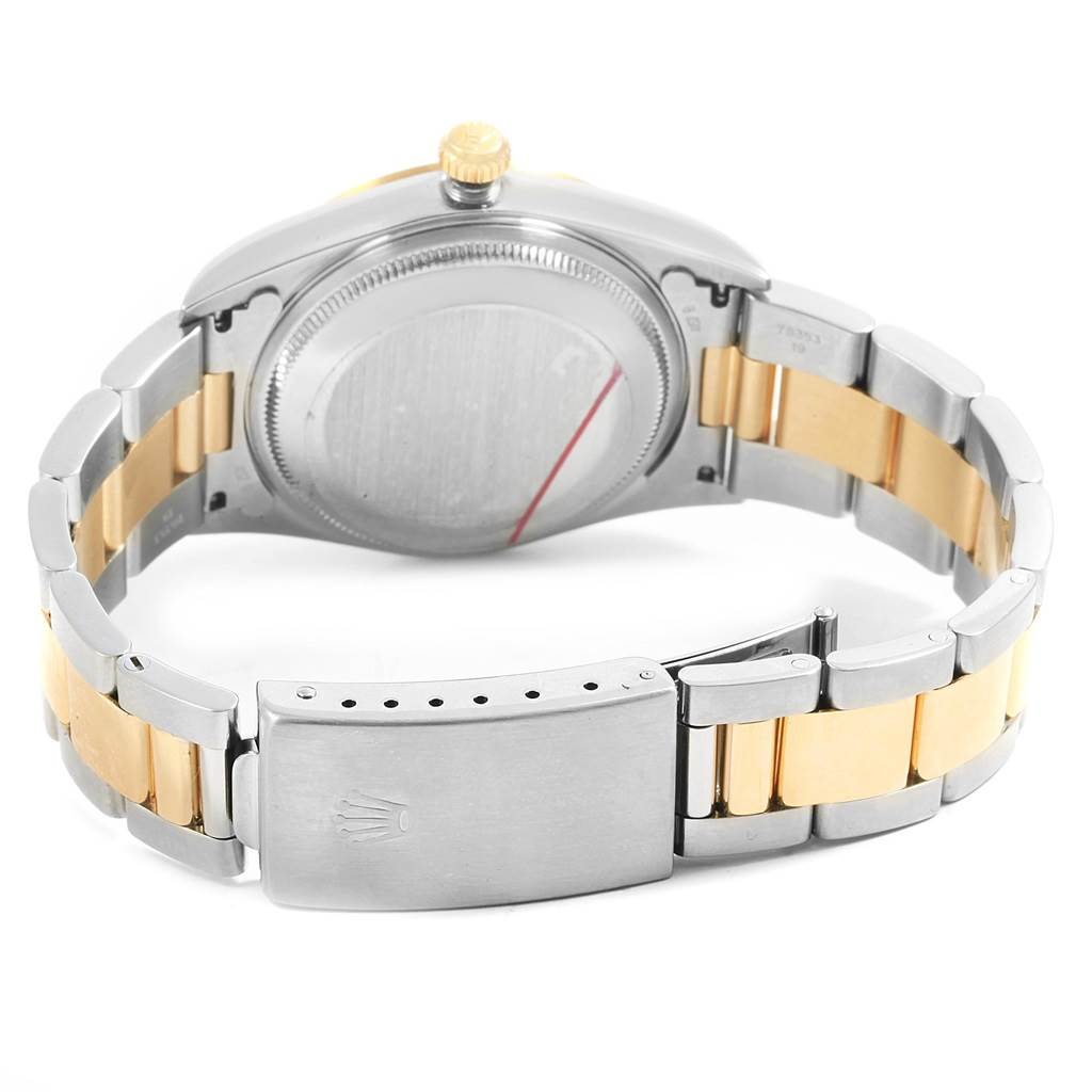 This image shows the back of the Rolex Oyster Perpetual 14203 Men
s Steel and Gold (two tone) Champagne Dial 14203 Men
s Steel and Gold (two tone) Champagne Dial watch, featuring its bracelet and clasp.