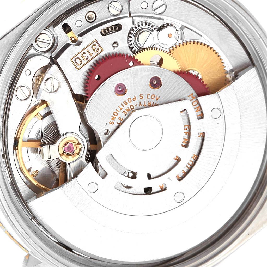 The image shows a close-up of the movement and internal mechanism of a Rolex Oyster Perpetual 14203 Men
s Steel and Gold (two tone) Champagne Dial 14203 Men
s Steel and Gold (two tone) Champagne Dial model watch.