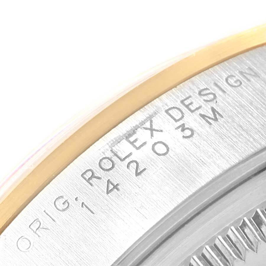 This image shows the engraved case back edge of a Rolex Oyster Perpetual 14203 Men
s Steel and Gold (two tone) Champagne Dial 14203 Men
s Steel and Gold (two tone) Champagne Dial watch, model number 14203M.