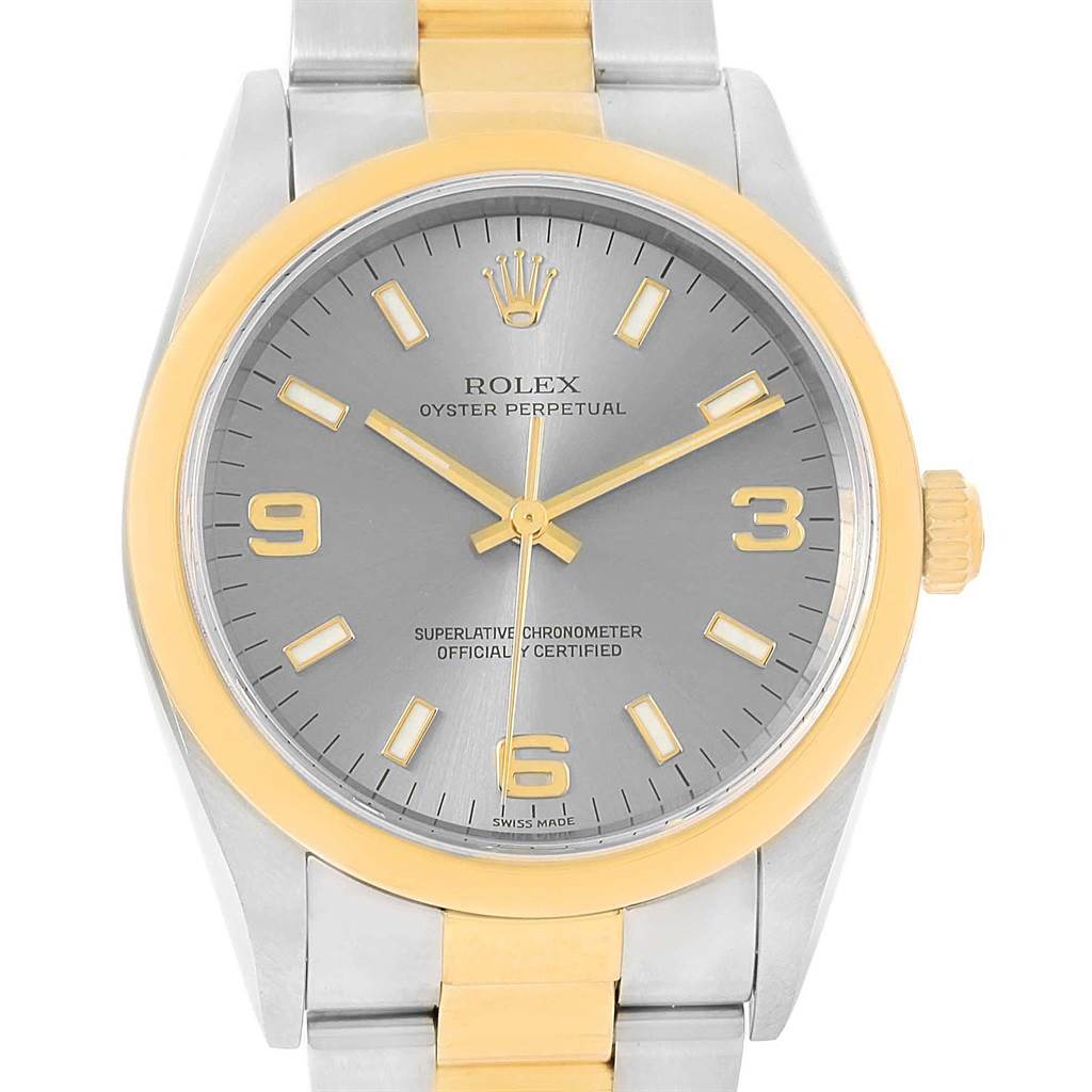 This image shows a front view of the Rolex Oyster Perpetual 14203 Men's Steel and Gold (two tone) Grey Dial 14203 Men's Steel and Gold (two tone) Grey Dial watch, highlighting the dial, bezel, and part of the bracelet.