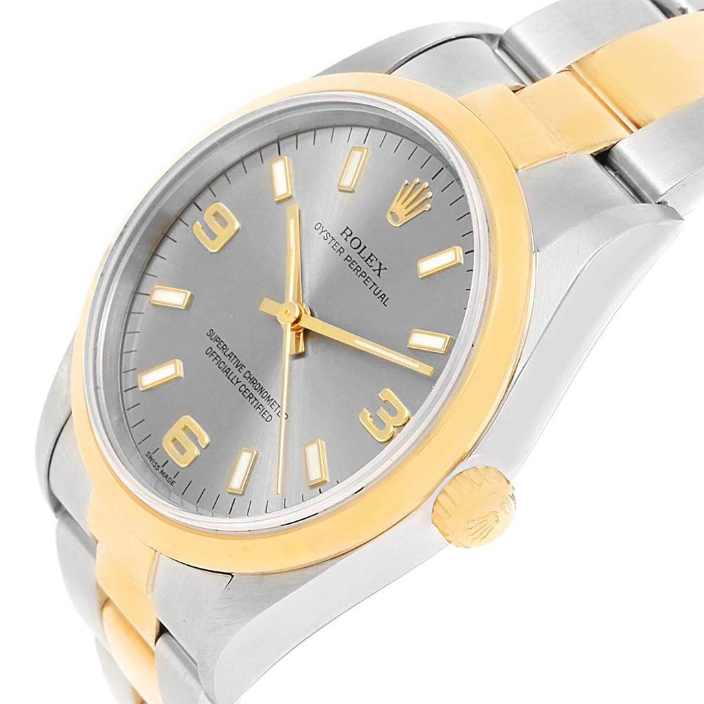 The image shows a side angle view of a Rolex Oyster Perpetual 14203 Men's Steel and Gold (two tone) Grey Dial 14203 Men's Steel and Gold (two tone) Grey Dial watch, highlighting the dial, crown, and part of the bracelet.