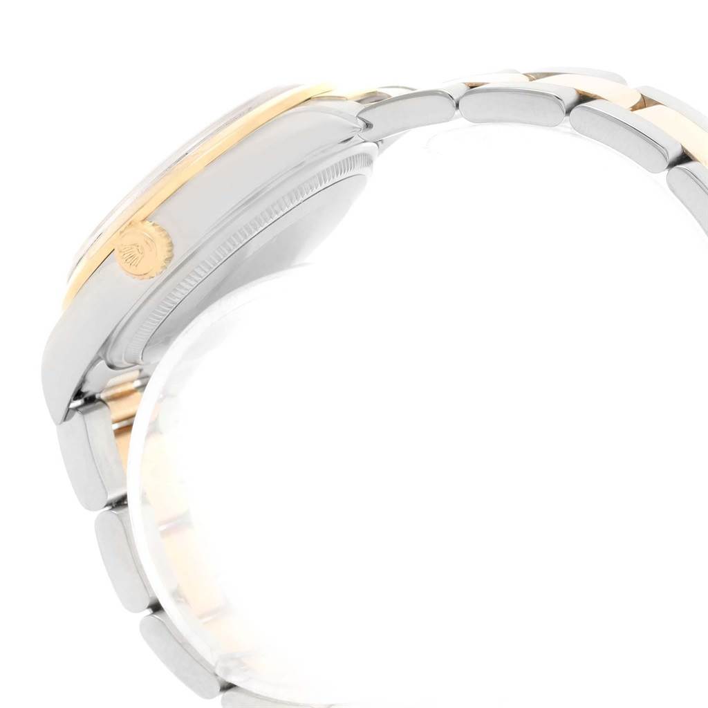 The image shows a side view of the Rolex Oyster Perpetual 14203 Men's Steel and Gold (two tone) Grey Dial 14203 Men's Steel and Gold (two tone) Grey Dial watch, highlighting the bracelet and the watch crown.