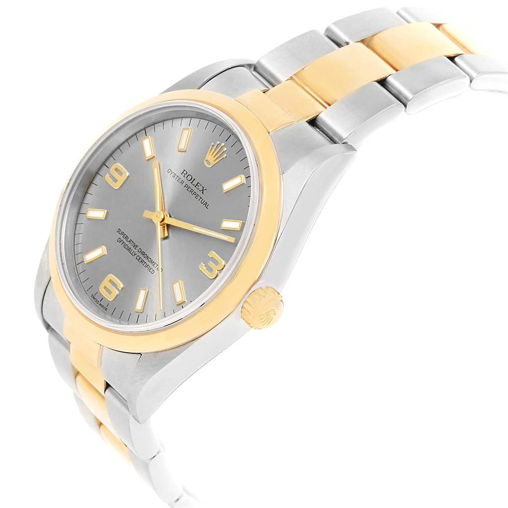The image shows a side view of the Rolex Oyster Perpetual 14203 Men's Steel and Gold (two tone) Grey Dial 14203 Men's Steel and Gold (two tone) Grey Dial watch, highlighting the dial, crown, and two-tone bracelet.