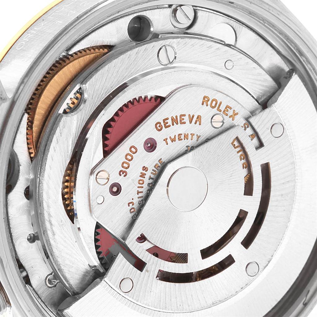 This image shows the internal mechanism of a Rolex Oyster Perpetual 14203 Men's Steel and Gold (two tone) Grey Dial 14203 Men's Steel and Gold (two tone) Grey Dial watch, highlighting gears and inscriptions.