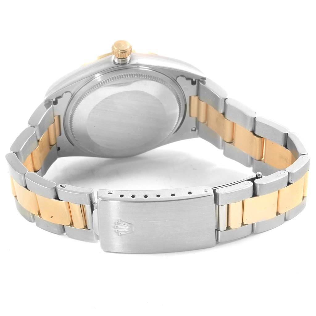 The image shows the back view of a Rolex Oyster Perpetual 14203 Men's Steel and Gold (two tone) Grey Dial 14203 Men's Steel and Gold (two tone) Grey Dial watch, highlighting its case back, crown, and two-tone bracelet with clasp.