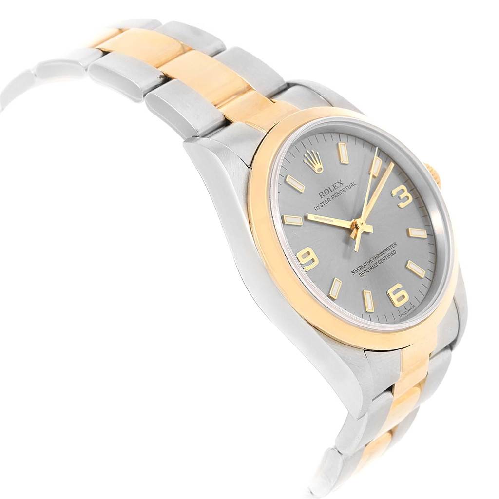 The image shows a side angle of a Rolex Oyster Perpetual 14203 Men's Steel and Gold (two tone) Grey Dial 14203 Men's Steel and Gold (two tone) Grey Dial watch, highlighting its two-tone bracelet and gray dial.