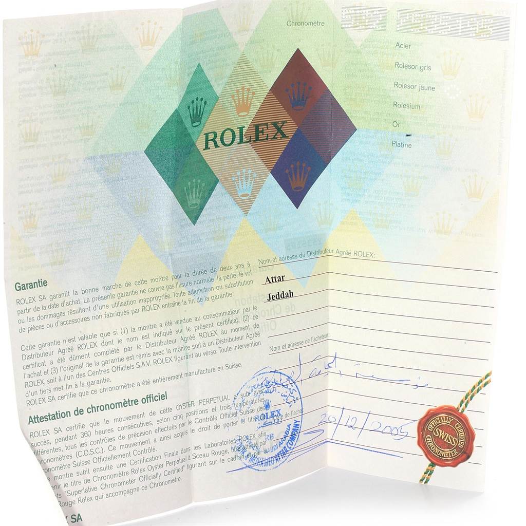 The image shows a warranty card and certificate for a Rolex Oyster Perpetual 14233 Men's Steel and Gold (two tone) Grey Dial 14233 Men's Steel and Gold (two tone) Grey Dial watch, photographed from a forward-facing angle.