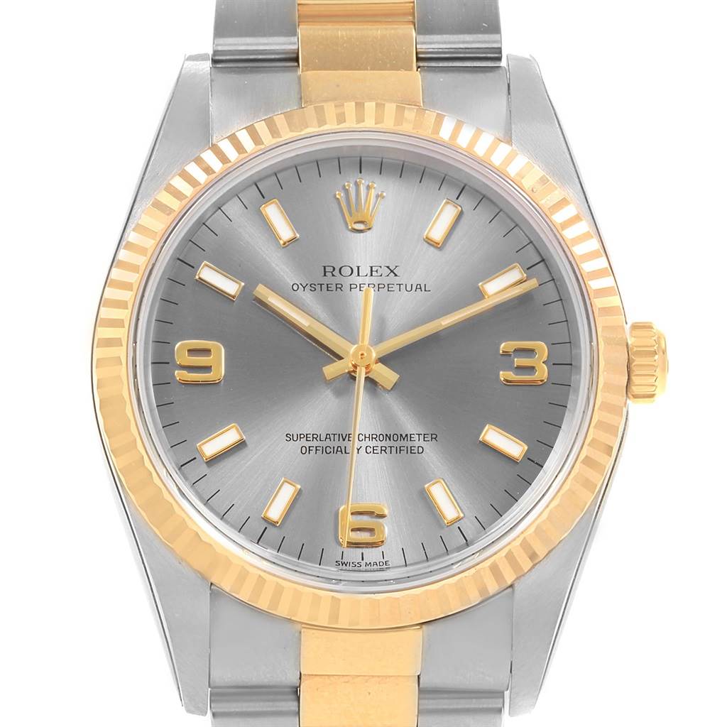 The image shows a front view of the Rolex Oyster Perpetual 14233 Men's Steel and Gold (two tone) Grey Dial 14233 Men's Steel and Gold (two tone) Grey Dial watch, highlighting its dial, bezel, and bracelet.