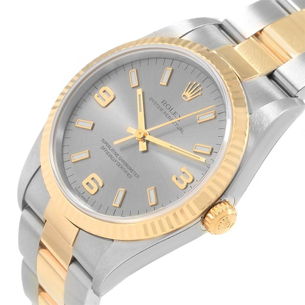 The image shows a close-up, angled view of the Rolex Oyster Perpetual 14233 Men's Steel and Gold (two tone) Grey Dial 14233 Men's Steel and Gold (two tone) Grey Dial watch, highlighting the dial, bezel, and bracelet.