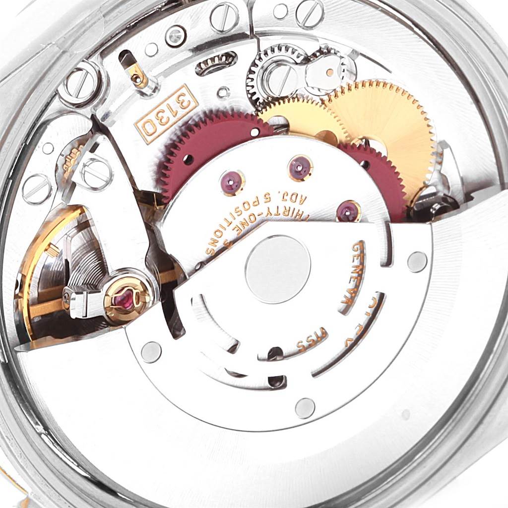 This image shows the intricate internal mechanism of a Rolex Oyster Perpetual 14233 Men's Steel and Gold (two tone) Grey Dial 14233 Men's Steel and Gold (two tone) Grey Dial watch, viewed from a close-up angle.
