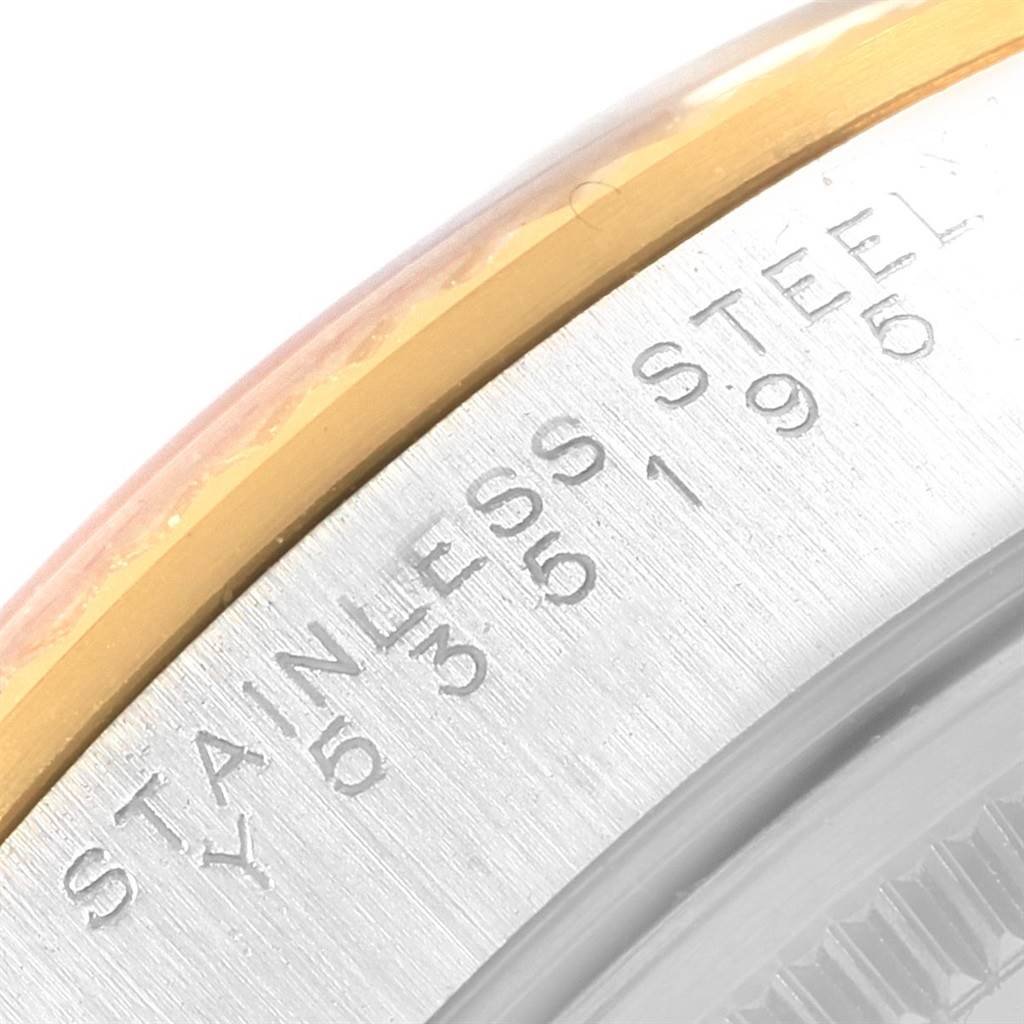 The image shows a close-up of the stainless steel and gold bezel and casing of a Rolex Oyster Perpetual 14233 Men's Steel and Gold (two tone) Grey Dial 14233 Men's Steel and Gold (two tone) Grey Dial watch.