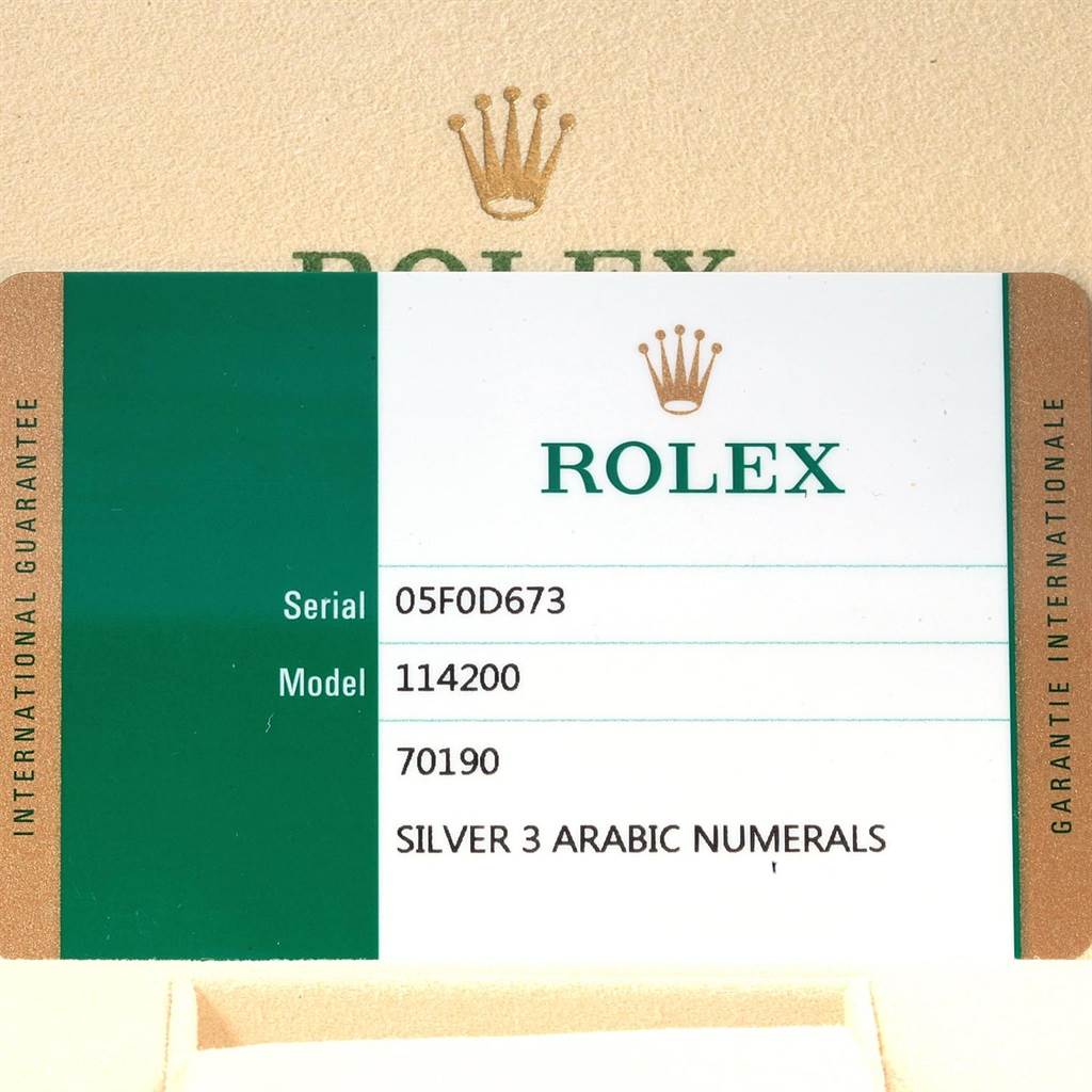 This image shows a guarantee card for the Rolex Oyster Perpetual 114200 Men's Stainless Steel Silver Dial 114200 Men's Stainless Steel Silver Dial model 114200 with serial number 05F0D673.