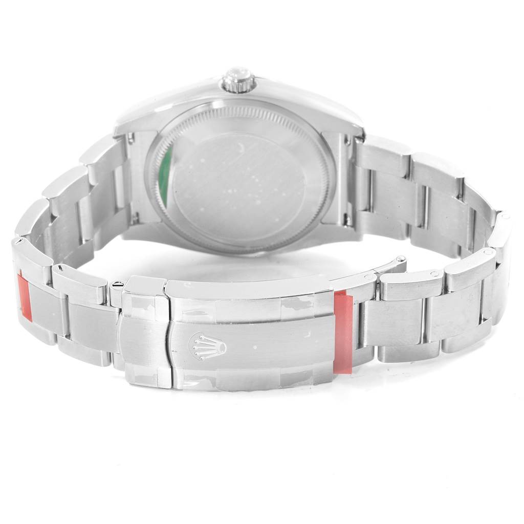 The image shows the back of the Rolex Oyster Perpetual 114200 Men's Stainless Steel Blue Dial 114200 Men's Stainless Steel Blue Dial watch, including the case back and extended metal bracelet with the clasp.