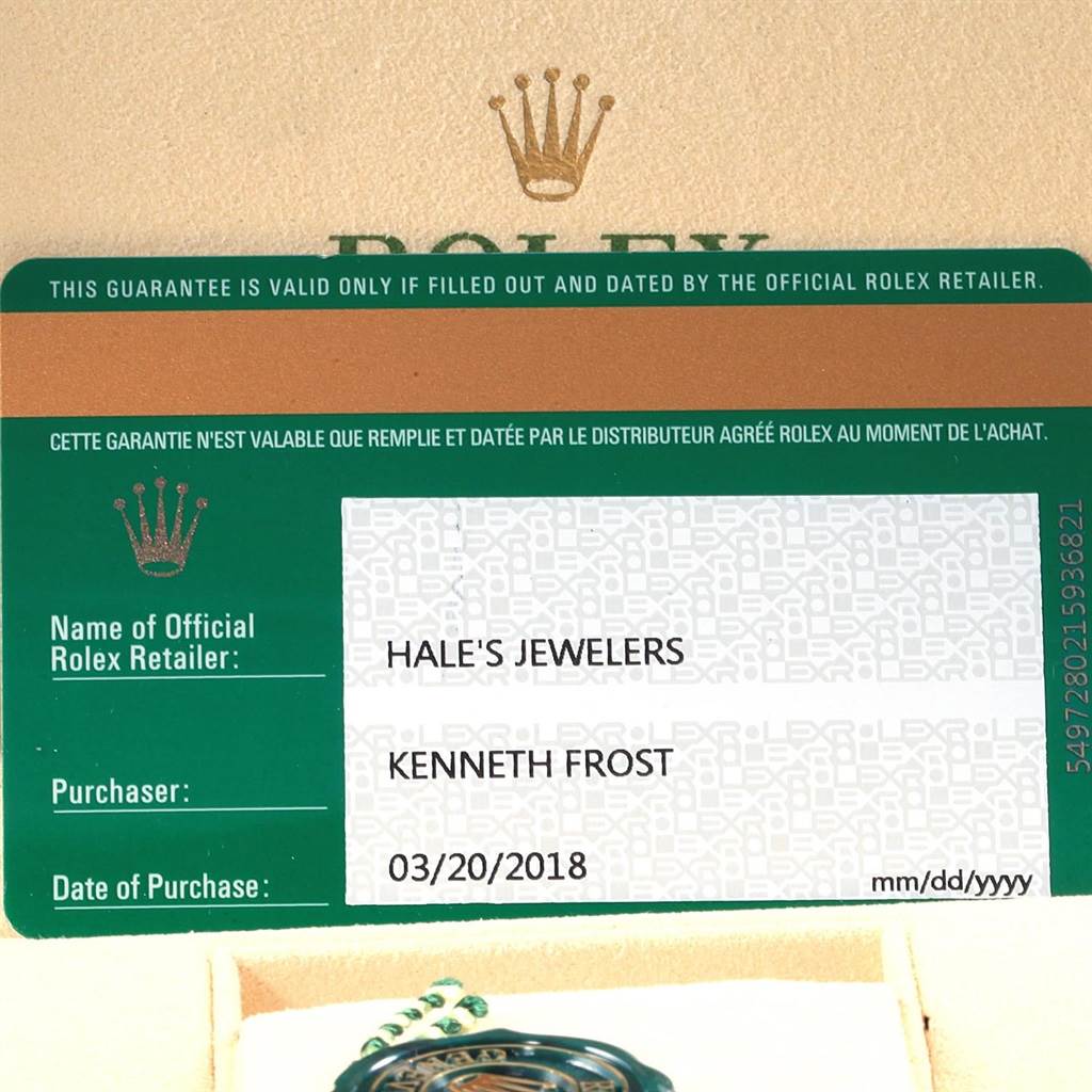 The image shows a warranty card with the official retailer and purchase details for a Rolex Oyster Perpetual 114200 Men's Stainless Steel Blue Dial 114200 Men's Stainless Steel Blue Dial watch.