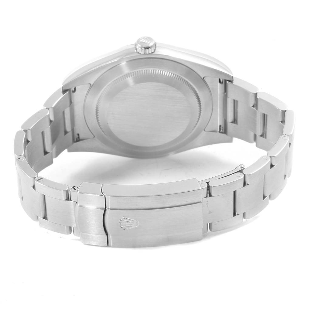 The image shows the back and bracelet of the Rolex Oyster Perpetual 114300 Men's Stainless Steel Grey Dial 114300 Men's Stainless Steel Grey Dial watch, specifically the clasp and case back.