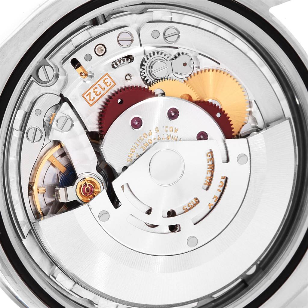 This image shows the intricate inner workings and movement components of a Rolex Oyster Perpetual 114300 Men's Stainless Steel Grey Dial 114300 Men's Stainless Steel Grey Dial watch from a top-down angle.