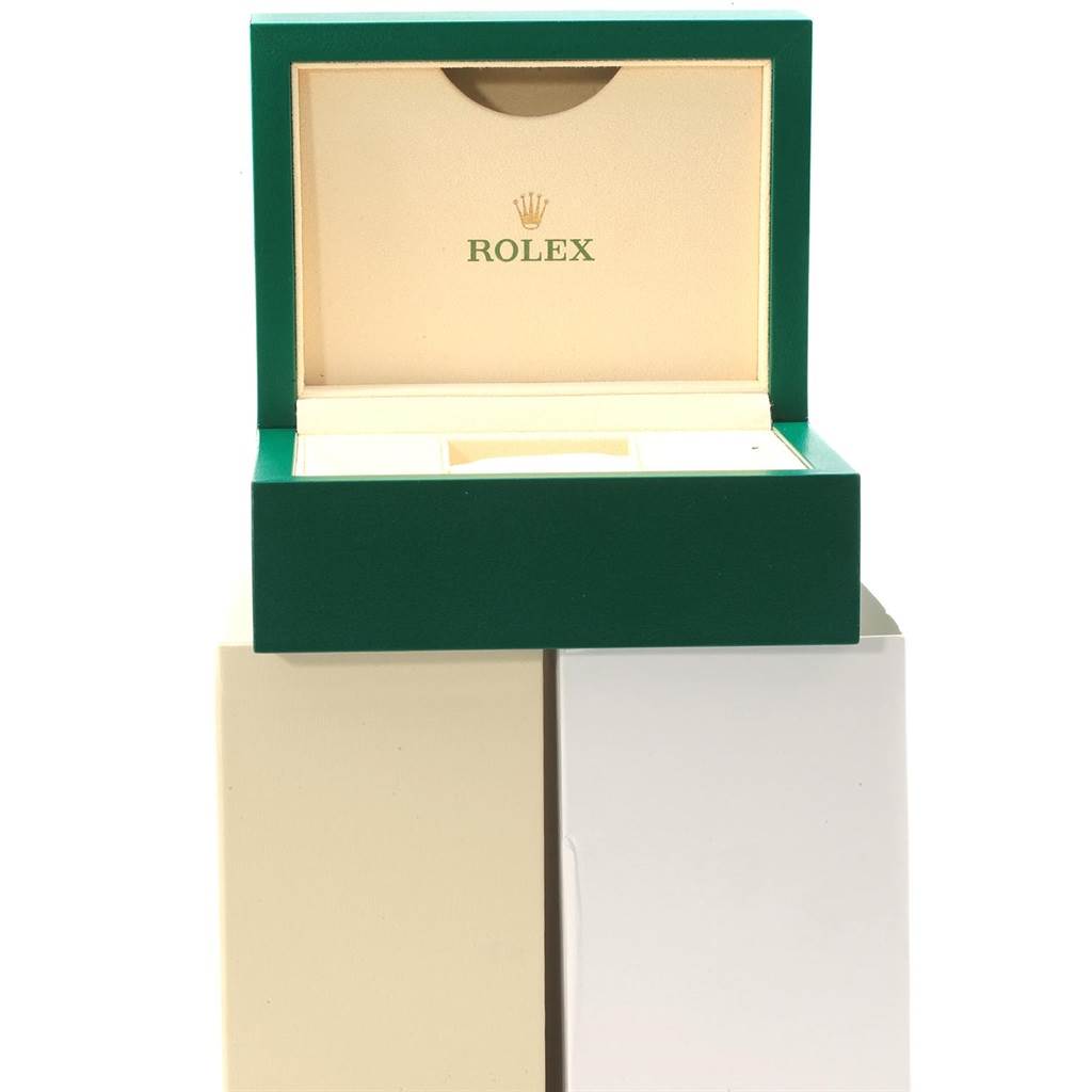 This image shows an empty Rolex Oyster Perpetual 114300 Men's Stainless Steel Grey Dial 114300 Men's Stainless Steel Grey Dial watch box from a frontal angle.
