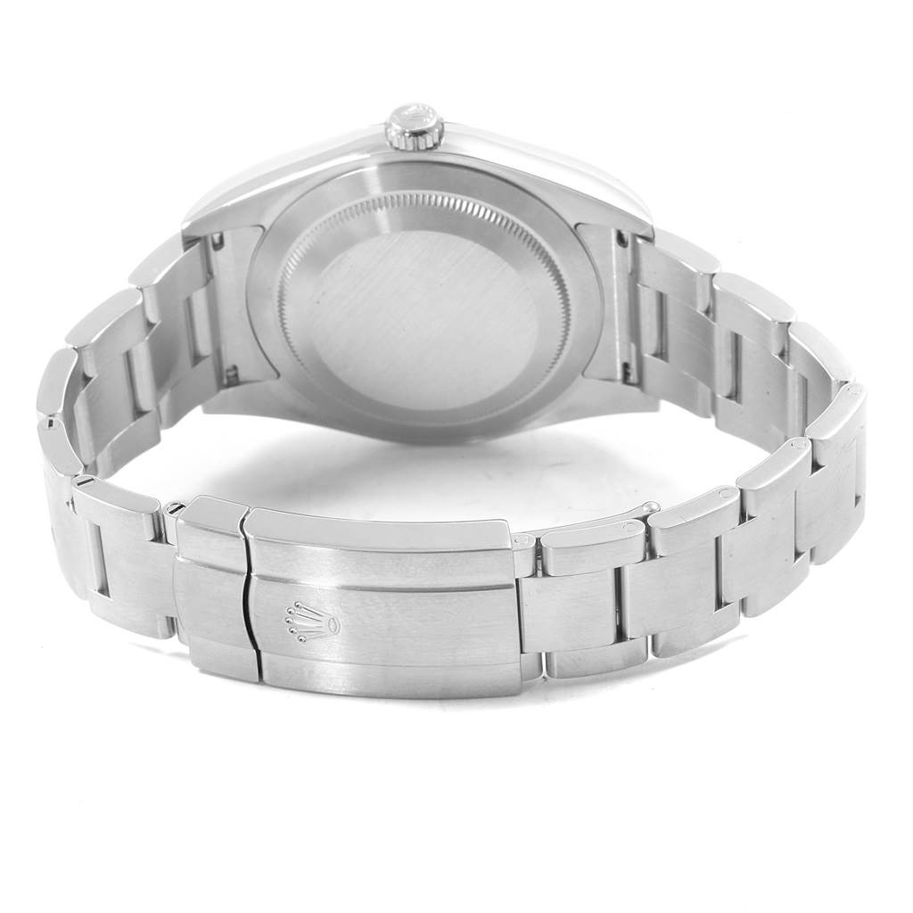 The image shows the back of a Rolex Oyster Perpetual 114300 Men's Stainless Steel Blue Dial 114300 Men's Stainless Steel Blue Dial watch, highlighting the case back and bracelet with a visible clasp.