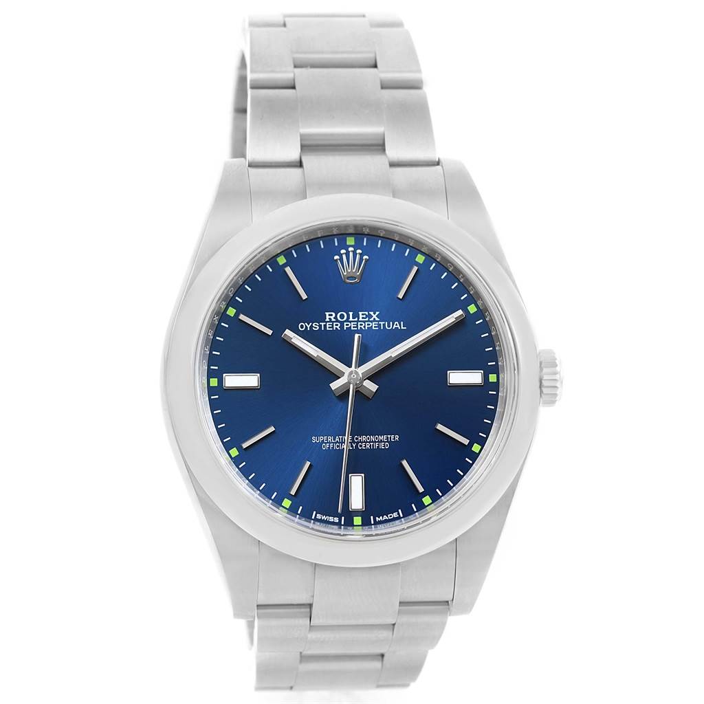 The image shows a front view of a Rolex Oyster Perpetual 114300 Men's Stainless Steel Blue Dial 114300 Men's Stainless Steel Blue Dial watch, displaying its blue dial, hour markers, hands, crown, and bracelet.