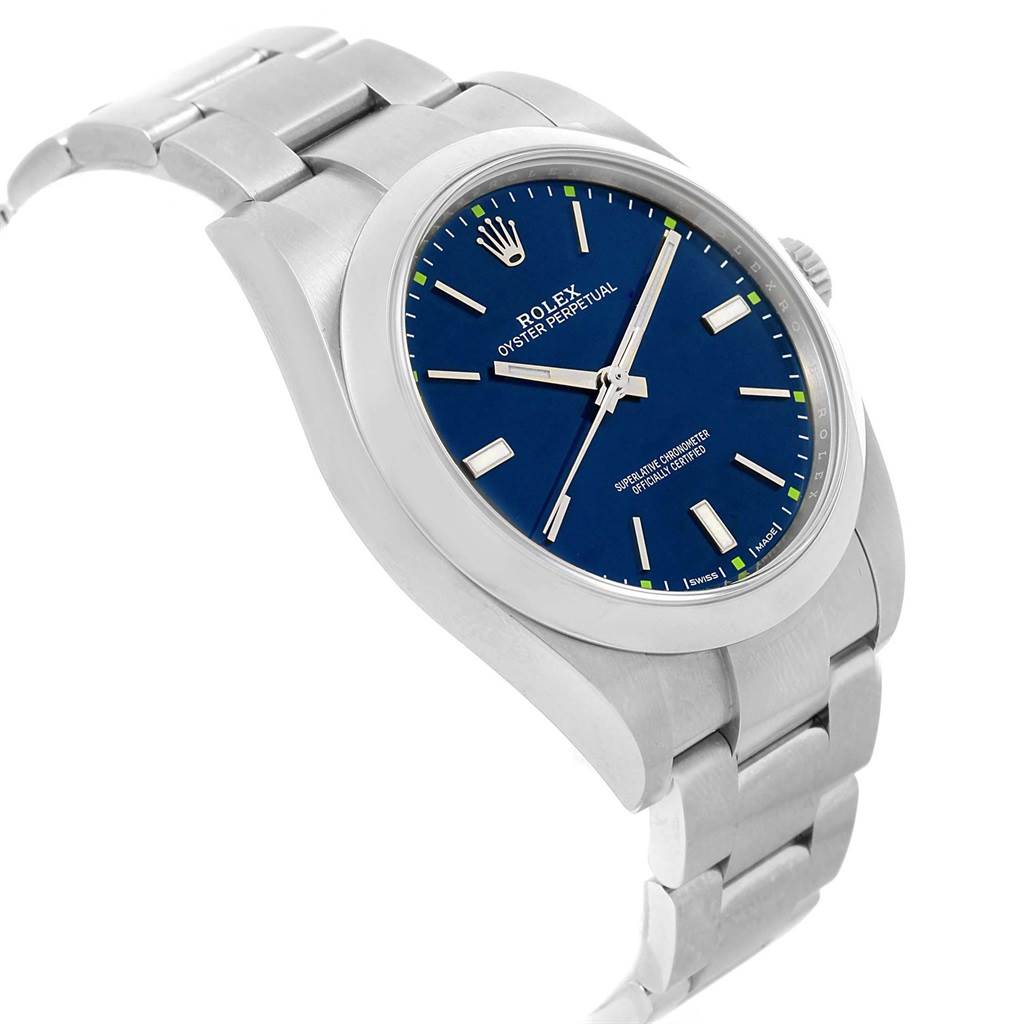 The image shows a side angle of the Rolex Oyster Perpetual 114300 Men's Stainless Steel Blue Dial 114300 Men's Stainless Steel Blue Dial watch, including its blue dial, case, and bracelet.