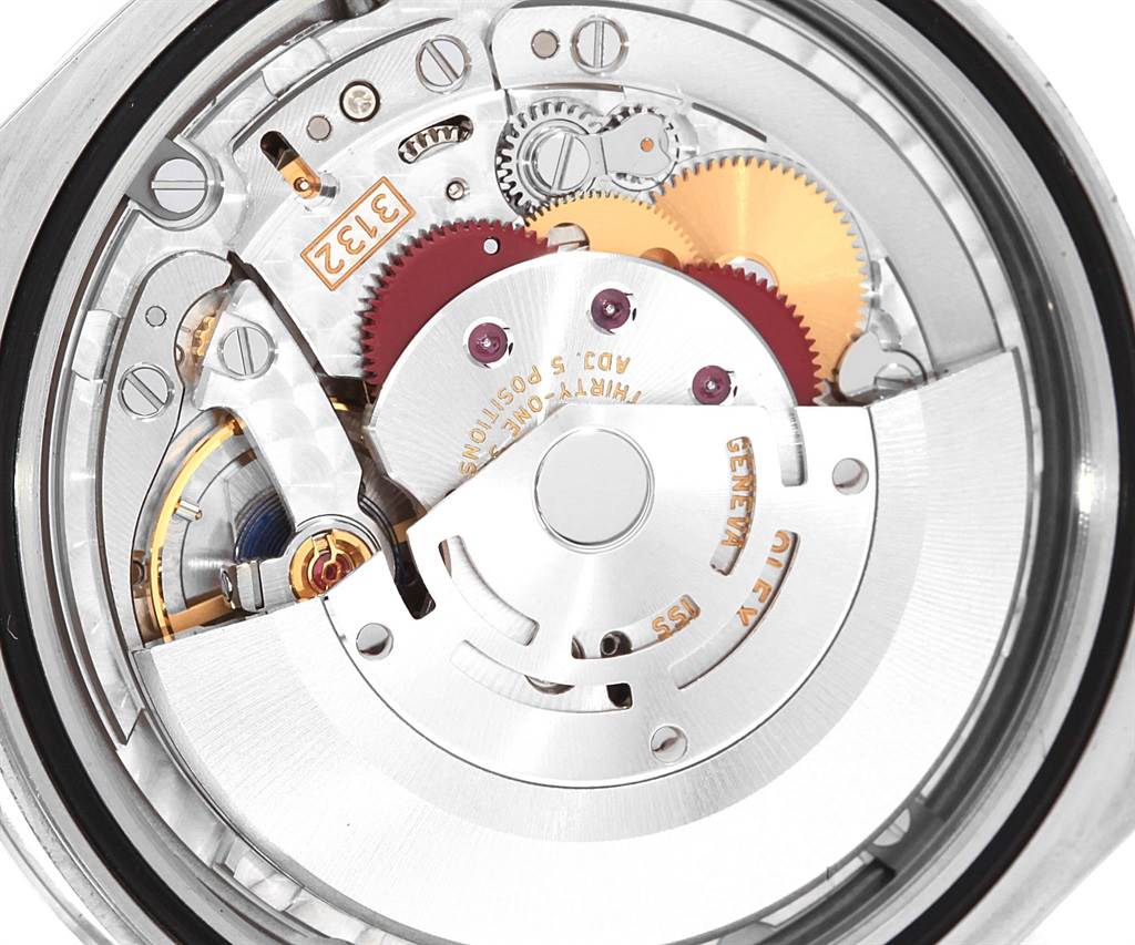 The image shows the internal mechanism of a Rolex Oyster Perpetual 114300 Men's Stainless Steel Blue Dial 114300 Men's Stainless Steel Blue Dial watch, focusing on its gears and rotor.